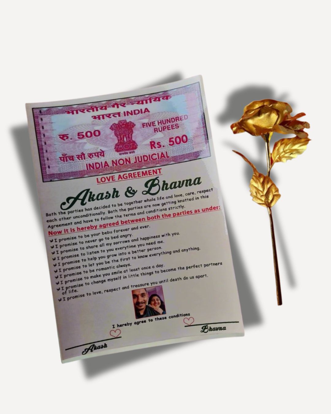 A personalized contract agreement document for a love pact, accompanied by a gold-colored rose, presumably as a symbol or gift related to the agreement.