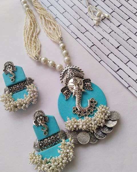 Baby blue color necklace and earrings with silver charm and coins and white beads 