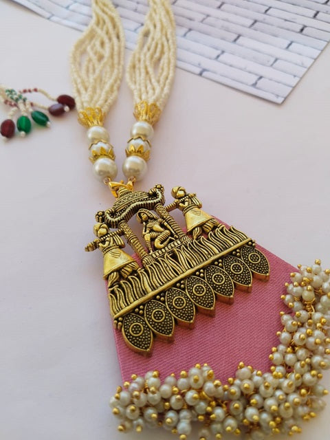 Light pink fabric necklace with heavy traditional golden work and white beads