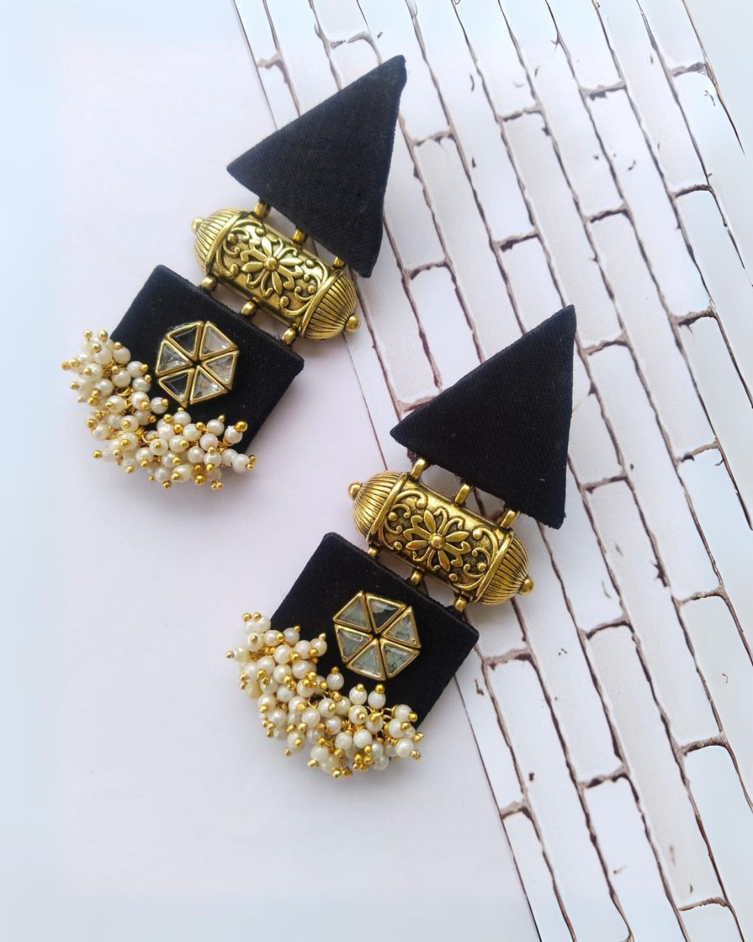 Black gold triangular earrings