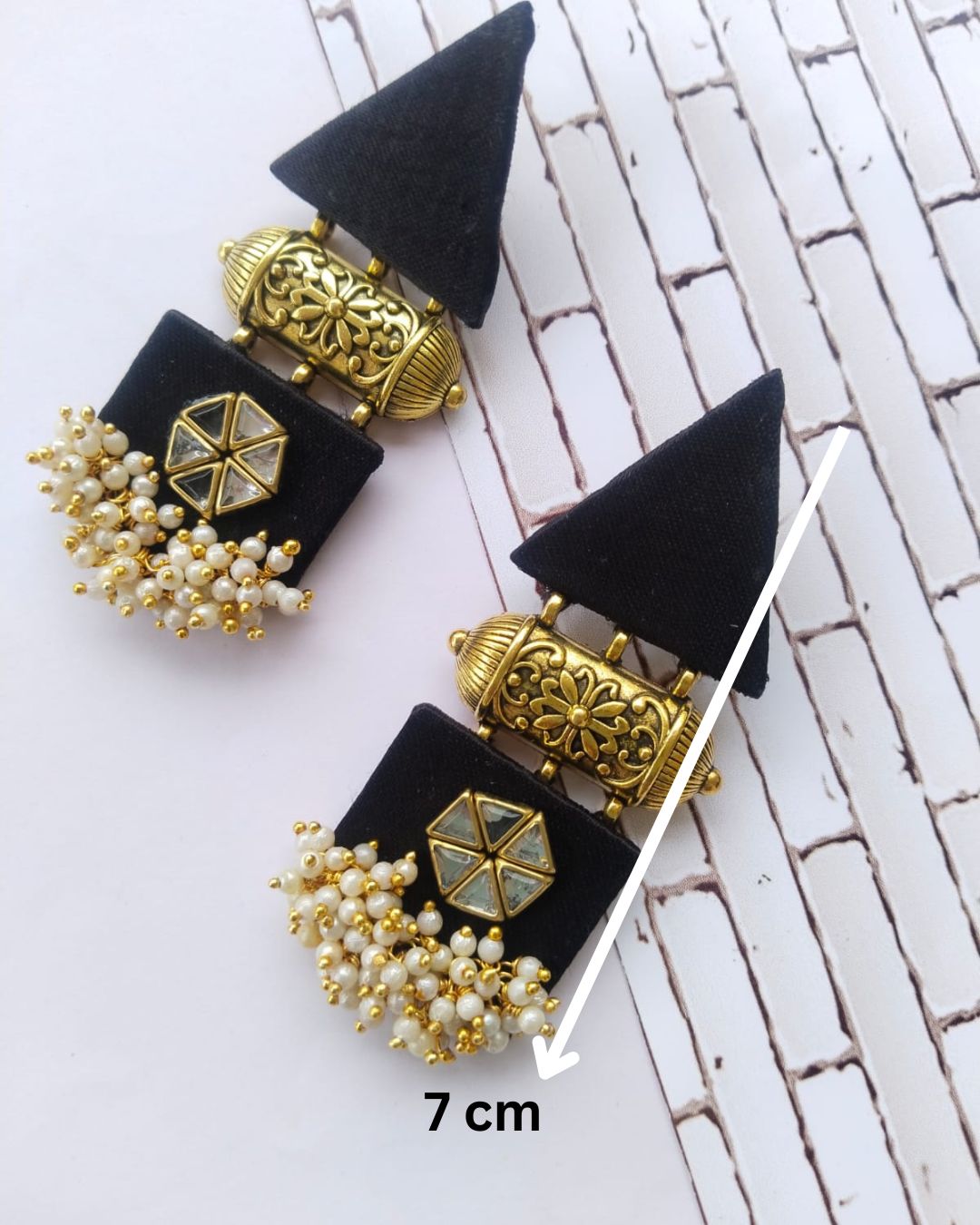 Black gold triangular earrings