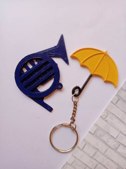 Blue french horn and umbrella keychain