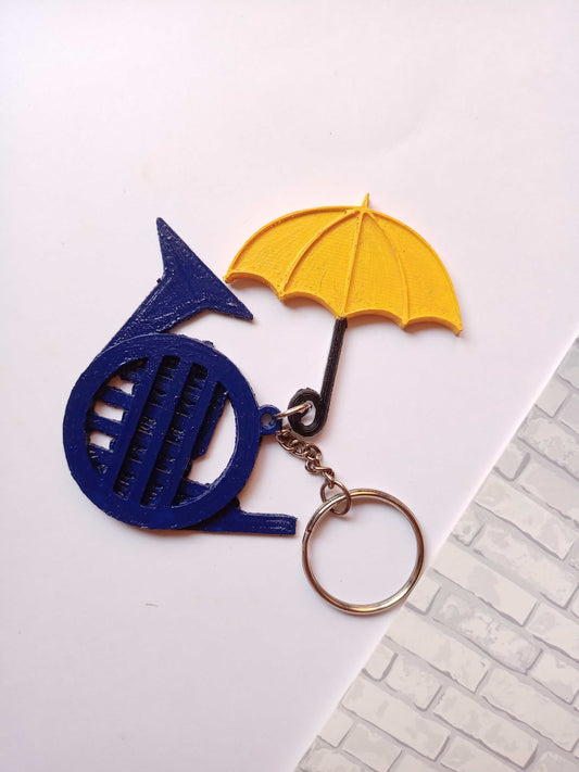 Blue french horn and umbrella keychain