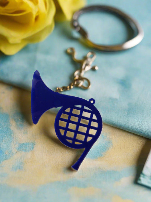 Blue french horn miniature keychain on white backdrop