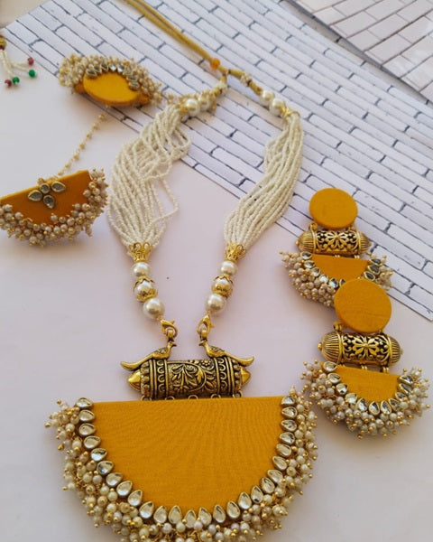 Bright yellow fabric necklace earrings and bracelet with kundan and white beads 
