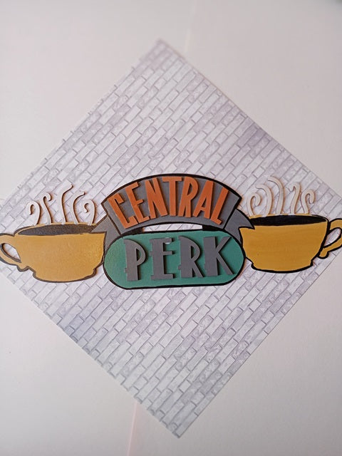 Central Perk Friends TV Wall Art in pastels made with MDF hanging on a grey bricks wall