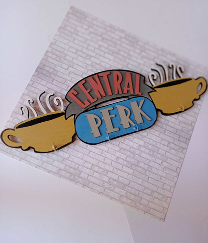 Friends TV central perk logo keyholder in pastel colors on a white base
