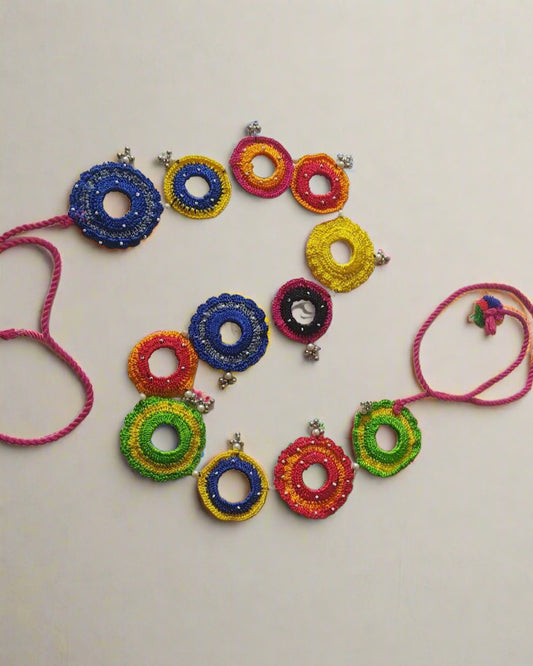 Multicolor round weaved with mirror and beads kamarband on white backdrop
