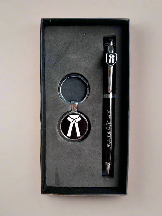 Hand holding Black box with pen and advocate keychain inside 