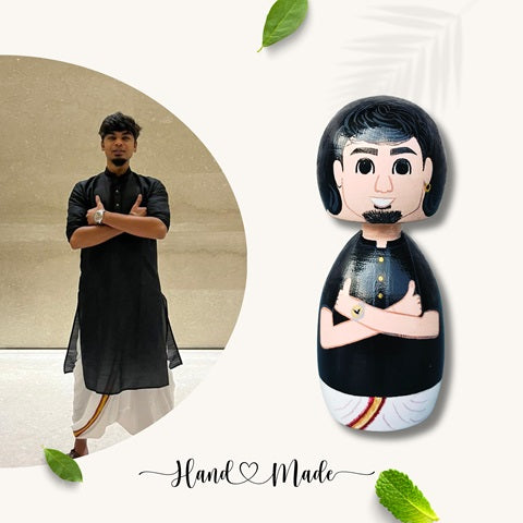 Wooden peggy miniature doll wearing black kurta and dhoti with reference image of a man on the left