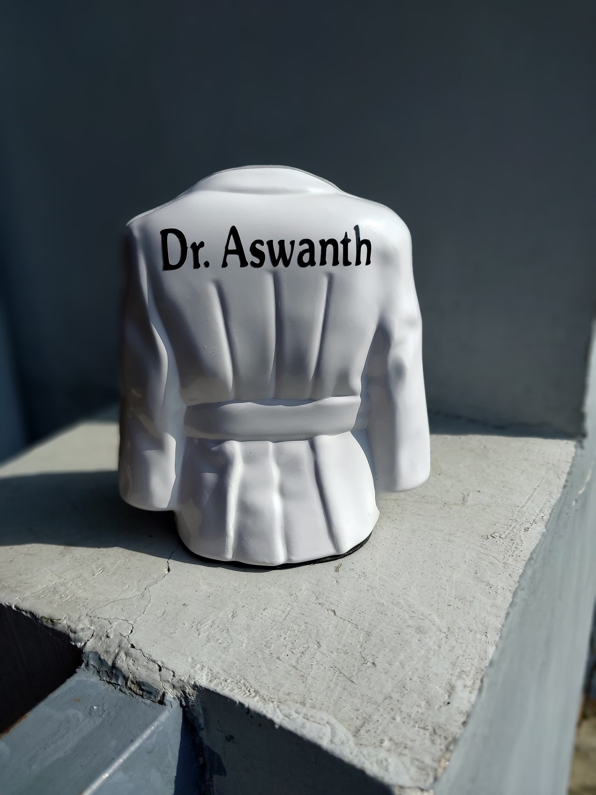 Doctor's apron shape white pen stand with male name engraved at back