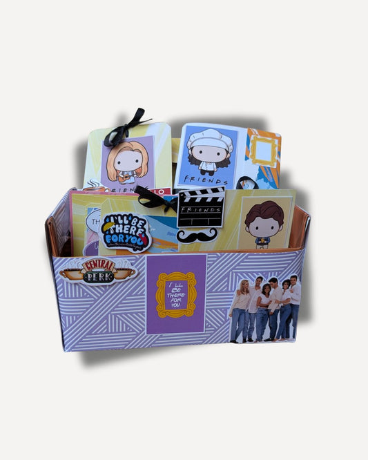 Collection of 'Friends' themed greeting cards in a box on a white background