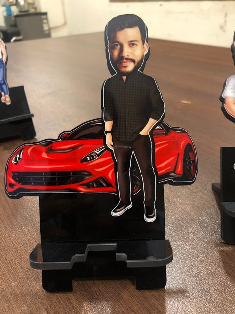 Funny photo Caricature customized mobile stand of a man wearing black with his hands in pocket and a car in the background