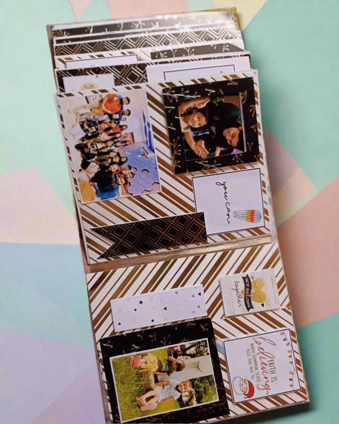 Black and silver customized scrapbook with happy pictures on a colorful backdrop