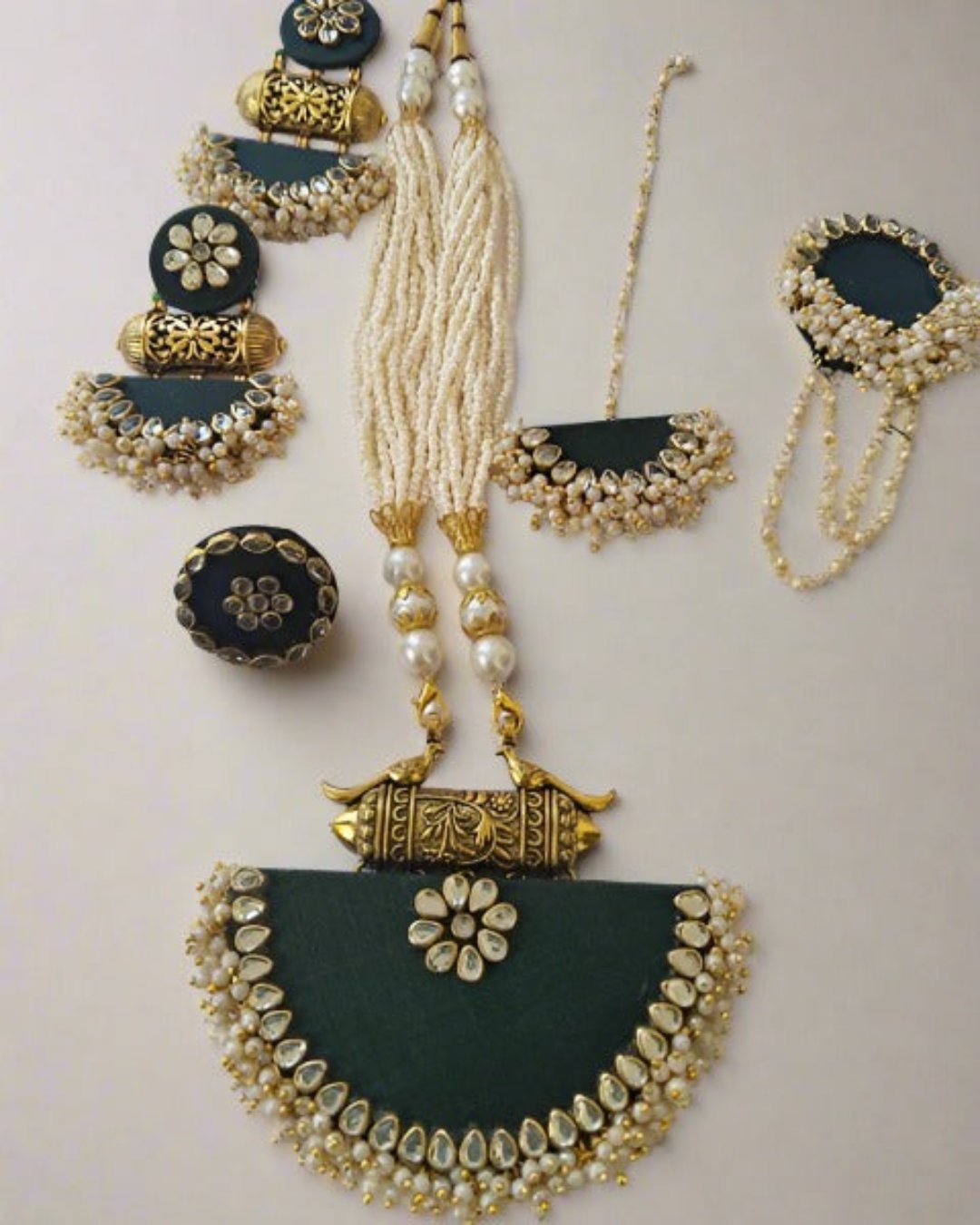 Bottle green traditional fabric necklace with kundan and white beads border and earrings