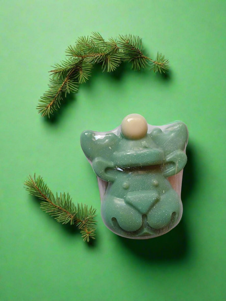 Green reindeer shaped soap bar on white backdrop