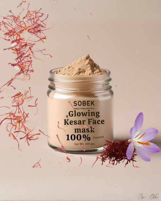 Sobek naturals kesar face mask in glass jar with kesar strands dropping on it 