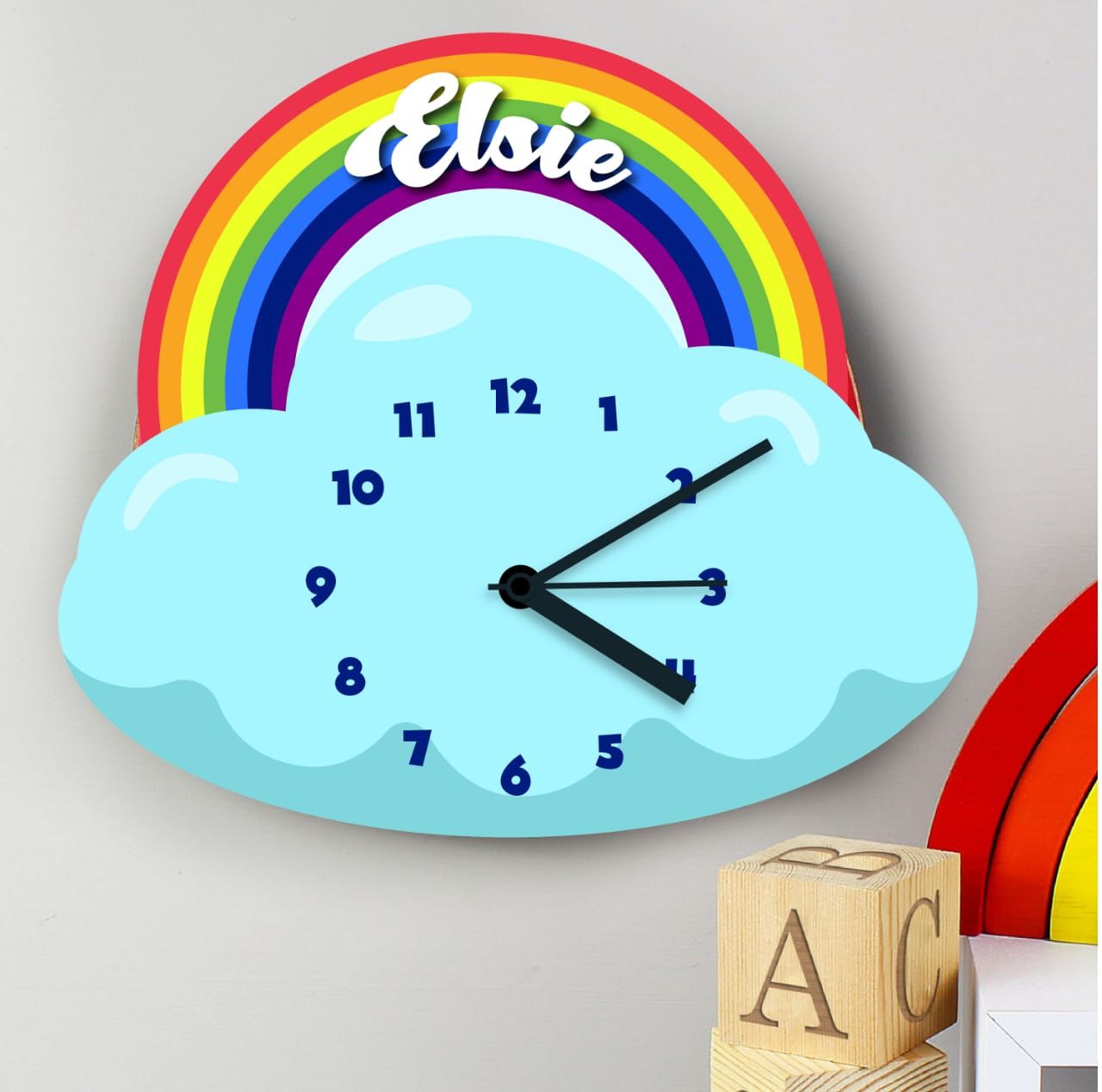 Kids customized cartoon clock in cloud and rainbow shape on a wall