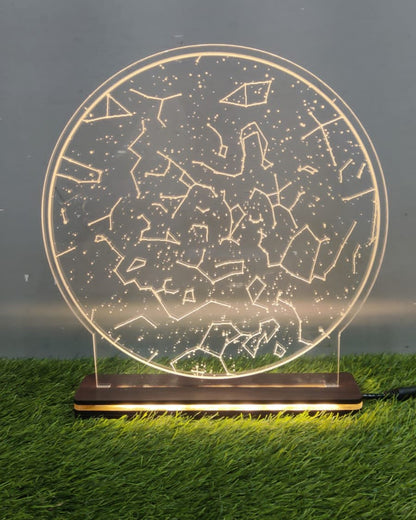 LED frame with golden lights on a round glass like showing constellation pattern