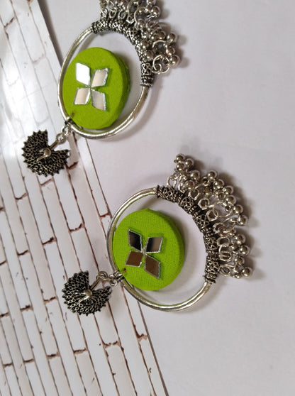 Light green round earrings with silver bali and ghungroos at bottom