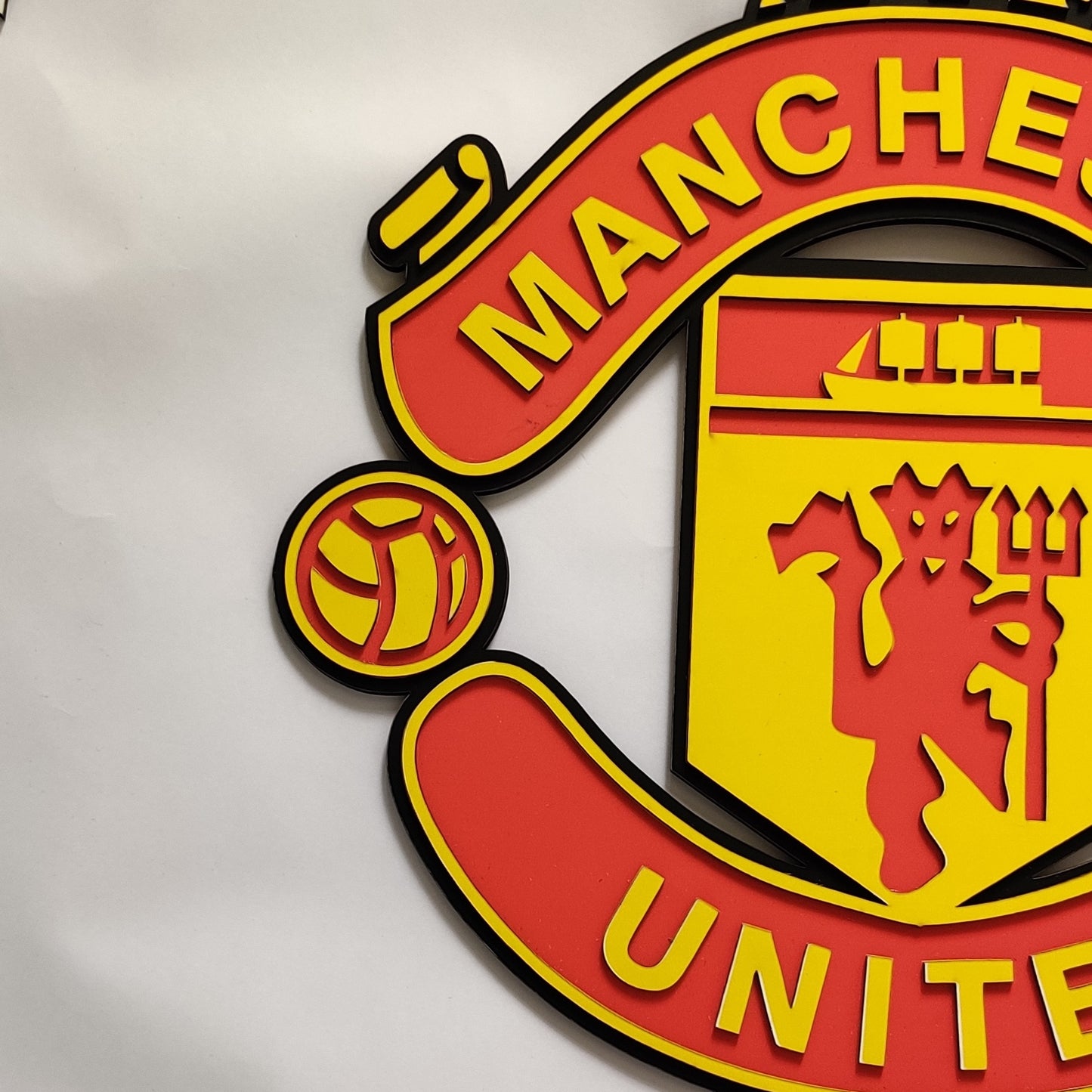 Manchester united red and yellow MDF wall art frame on white wall