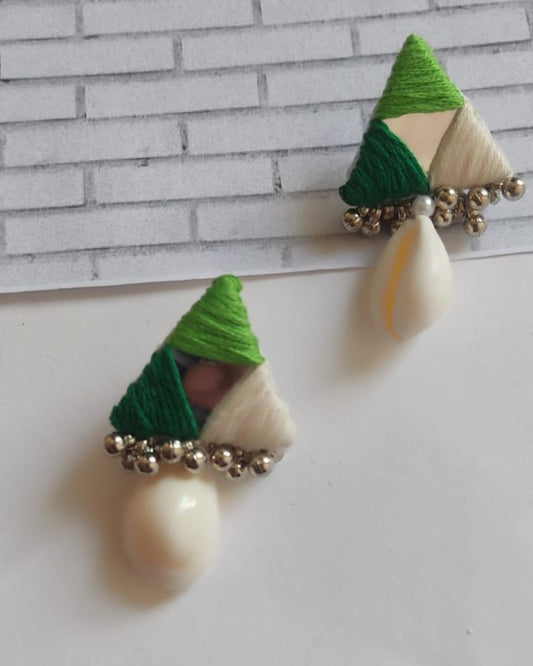 triangular studs earrings in green with a sea shell at bottom on a white backdrop