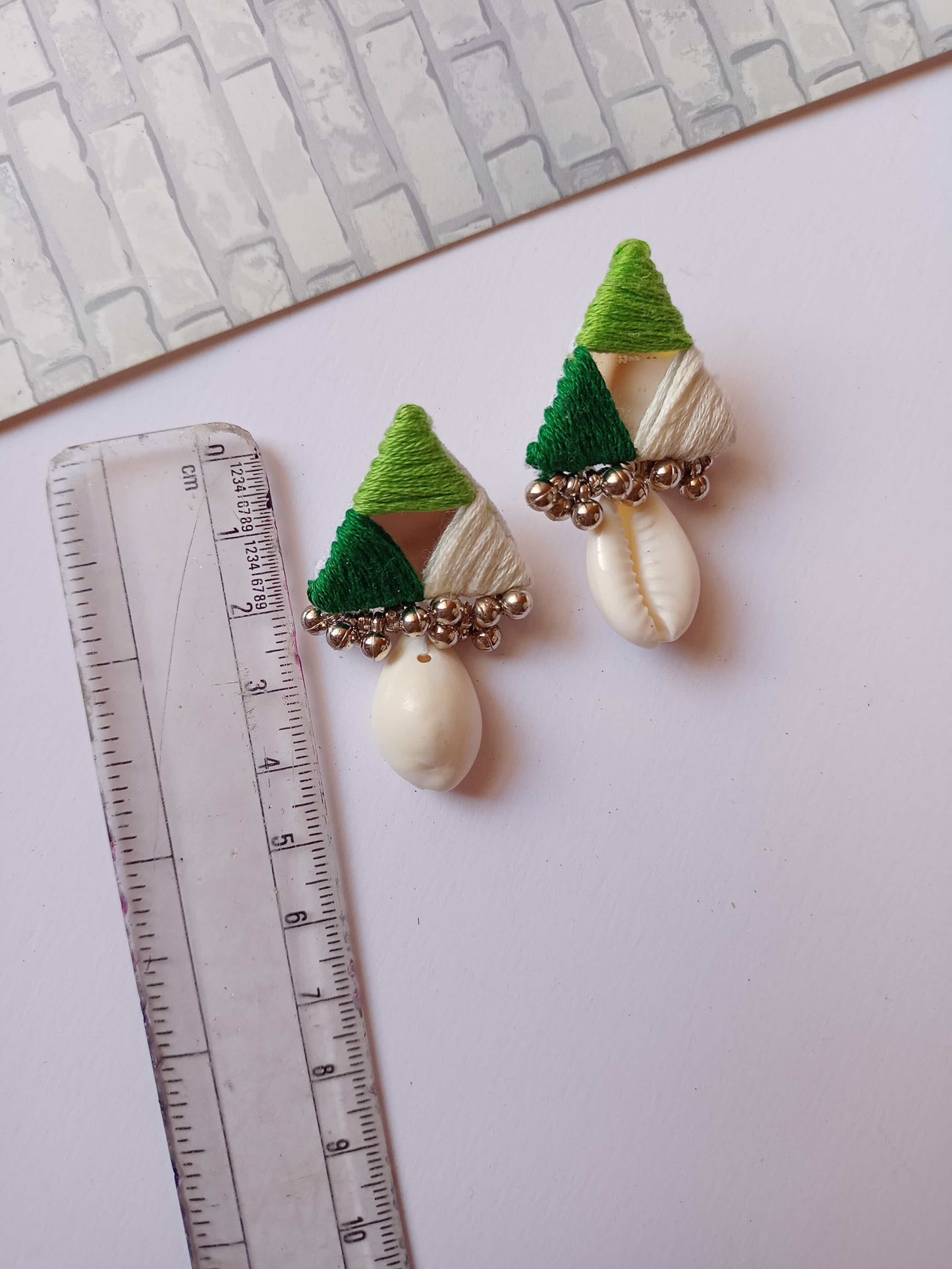 Rainvas Mirror triangle earrings in green white with cowry shell