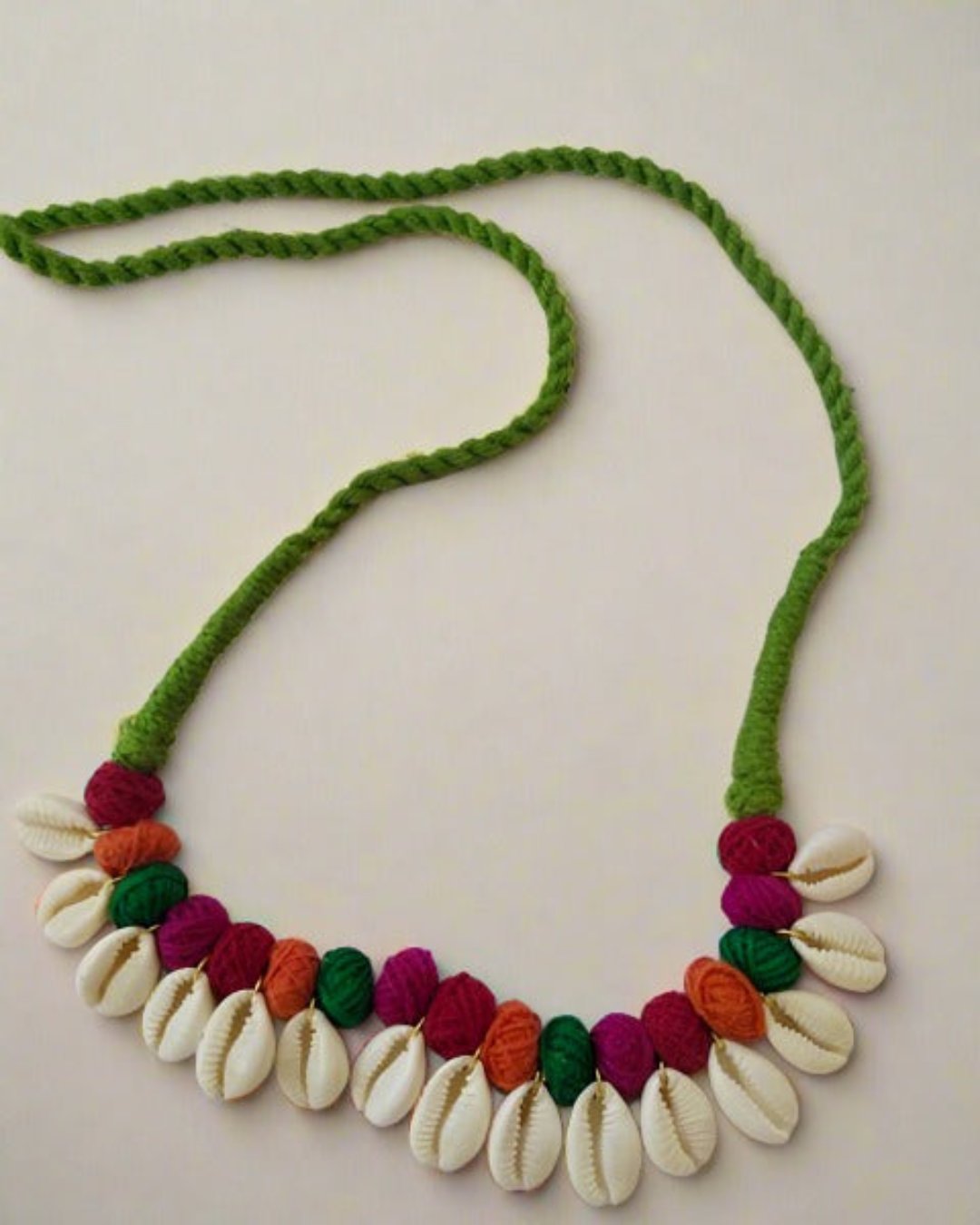 Multicolor pom pom with white sea shells fabric necklace