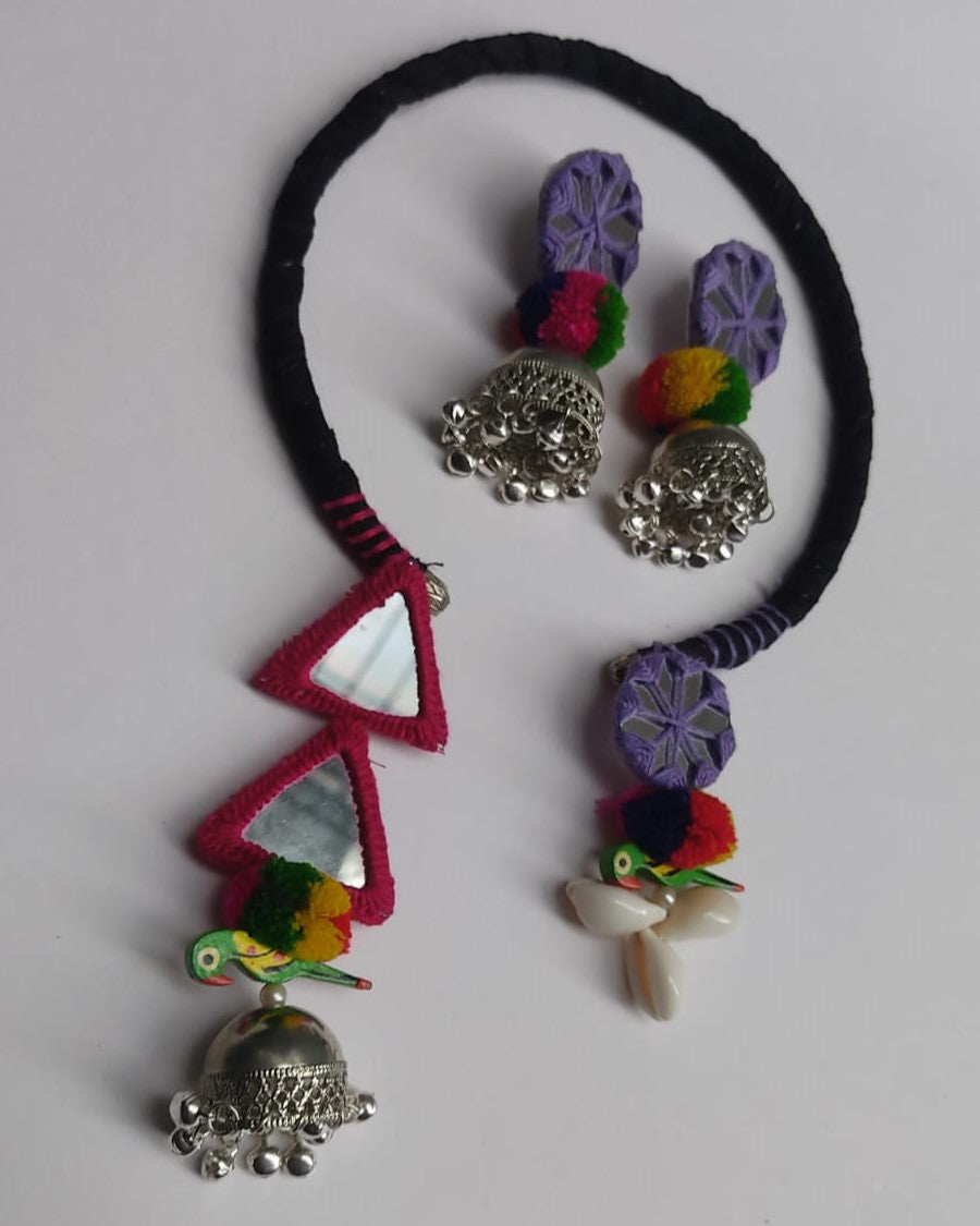 Black circular necklace with parrot, sea shells and silver ghungroo latkan and earrings set