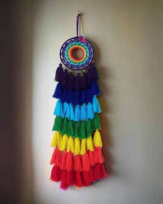 Multicolor tassels dreamcatcher on grey wall