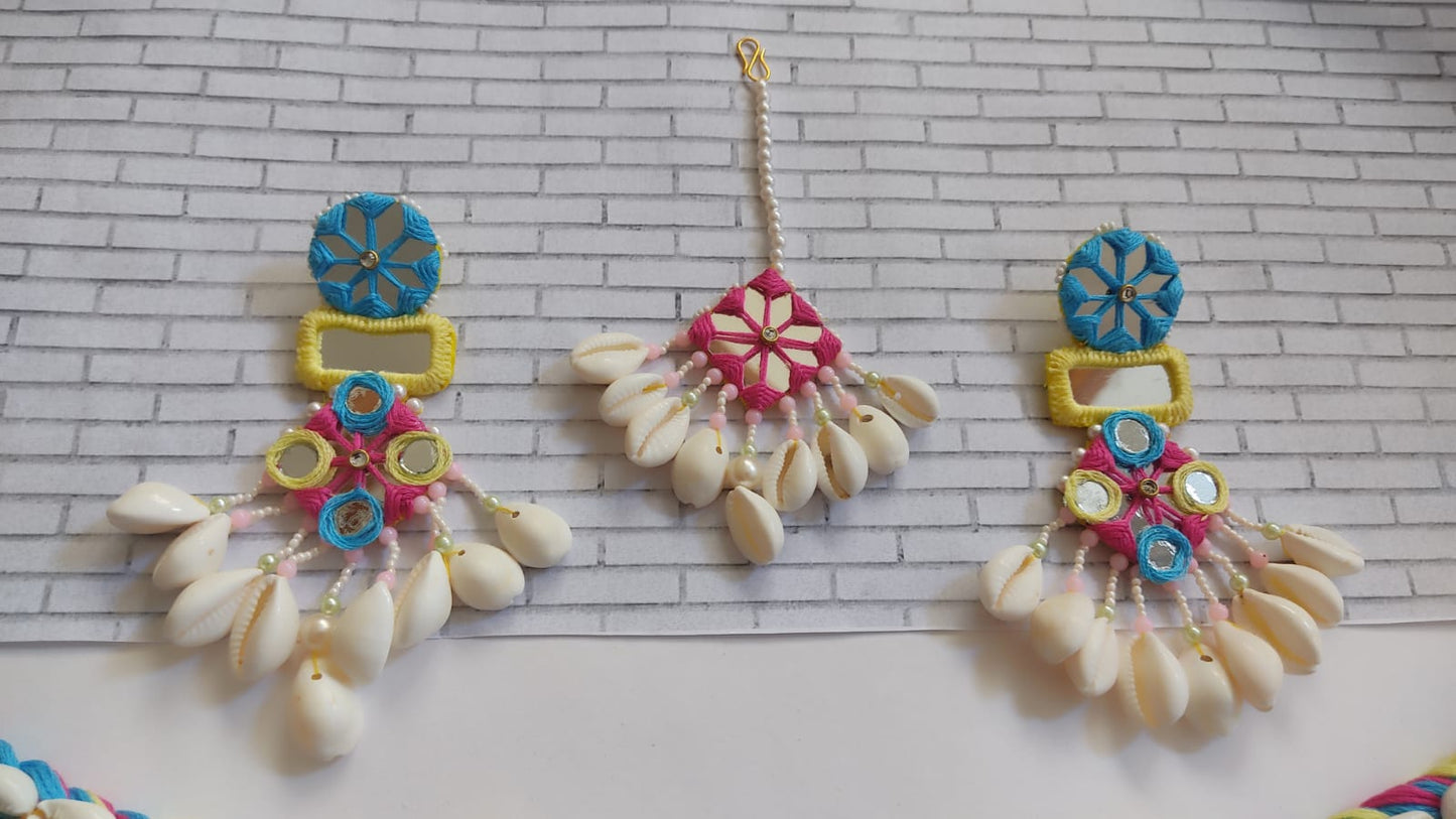 Yellow pink and blue earrings and tika with white sea shells and mirror details