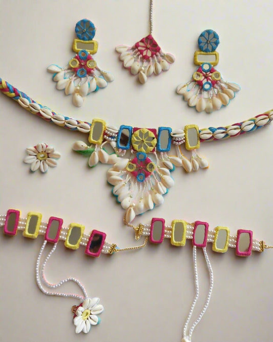 Yellow pink and red with mirror work, white pearls, sea shells necklace, earrings, tika and bracelet 