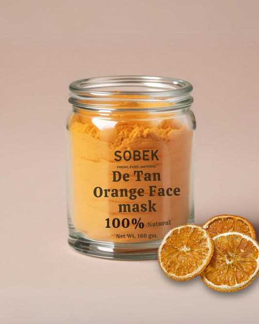 Sobek naturals orange face mask in glass jar with dry orange slices in front of it