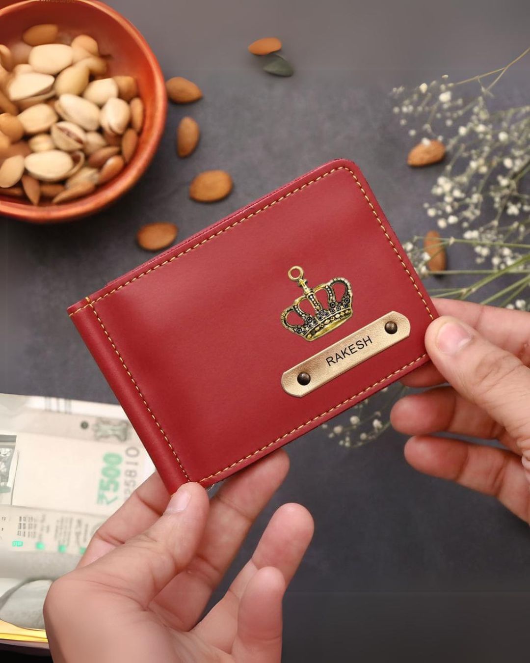 Wine red men's customized wallet held by a hand