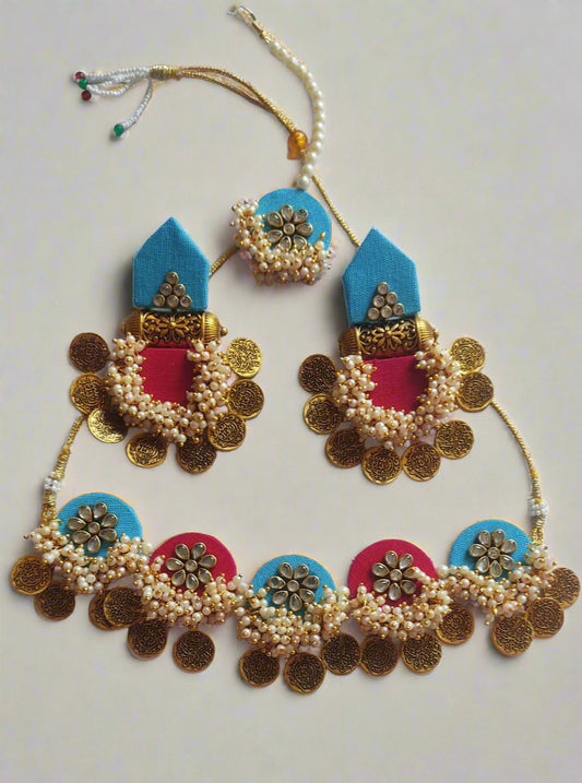 Pink and blue necklace and earrings with white beads, golden coins and white kundan
