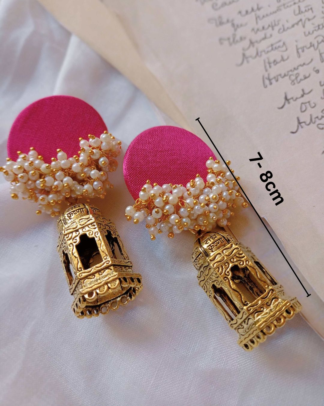 Rainvas Pink beaded earrings with golden temple bottom