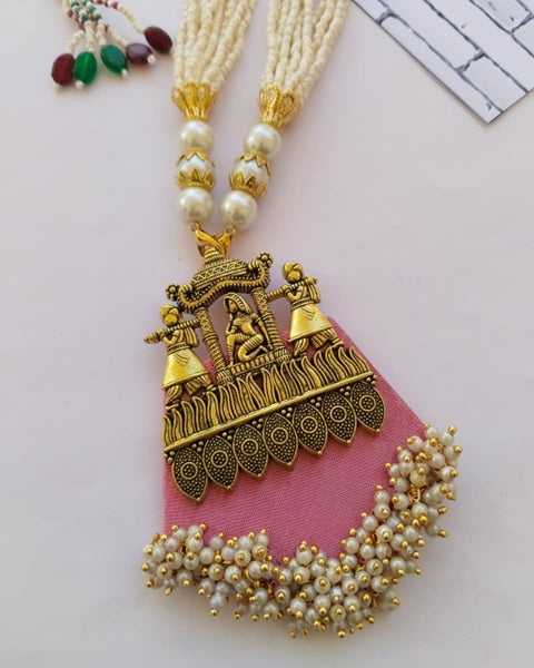 Light pink fabric necklace with heavy traditional golden work and white beads