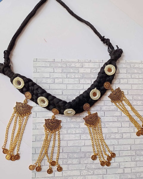 Black choker necklace with long golden chains, charms and coins 