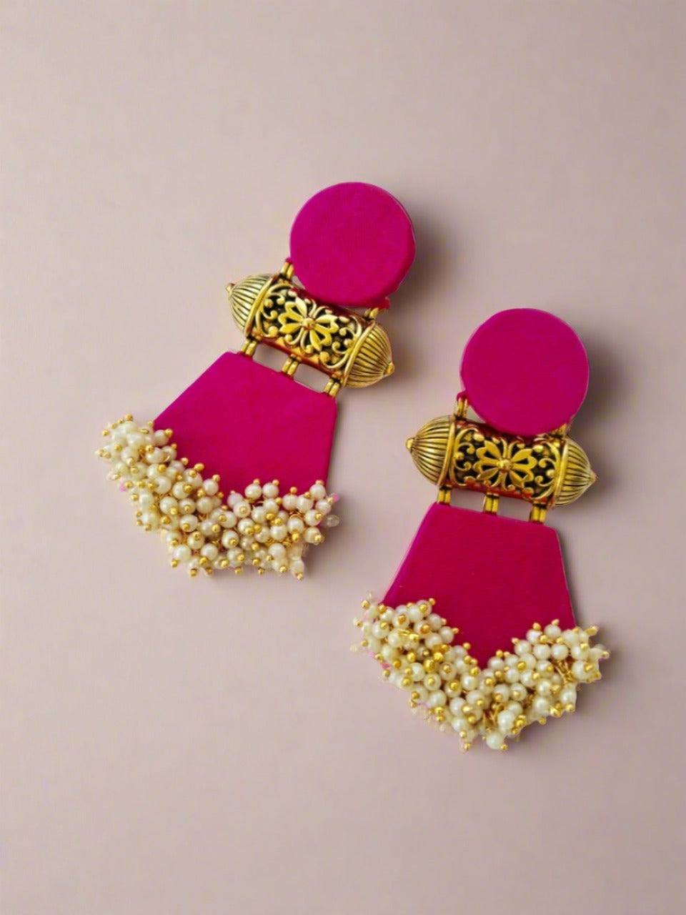 Pink earrings with golden tabiz, white beads on white backdrop