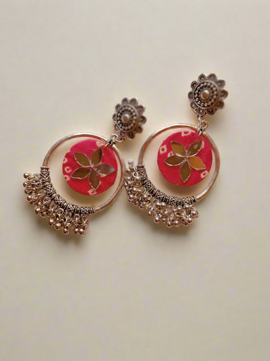 Pink bandhani print jhumka bali earrings on white and grey backdrop