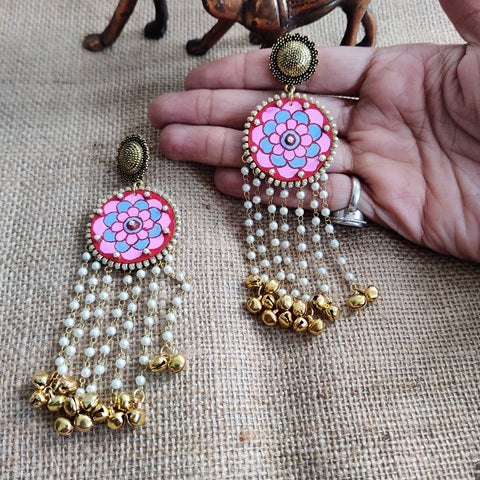 Pink and red mini mandala art work earrings with golden ghungroos at bottom