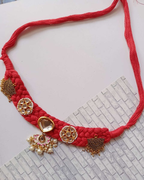 Red threads choker necklace with heavy kundan and golden charms