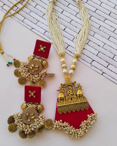 Red heavy necklace and earrings with golden charms coins and yellow white beads