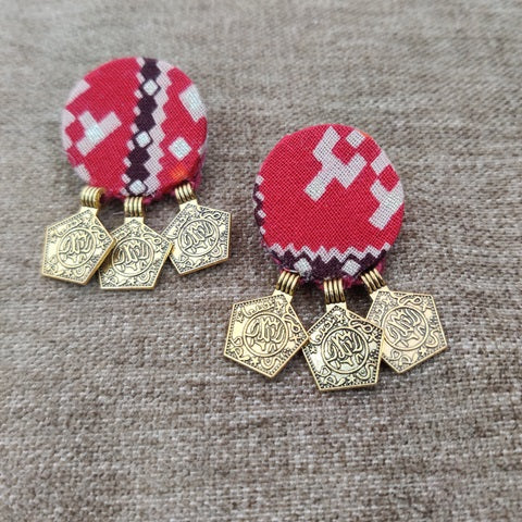 Red bandhani printed earrings with golden charms at bottom