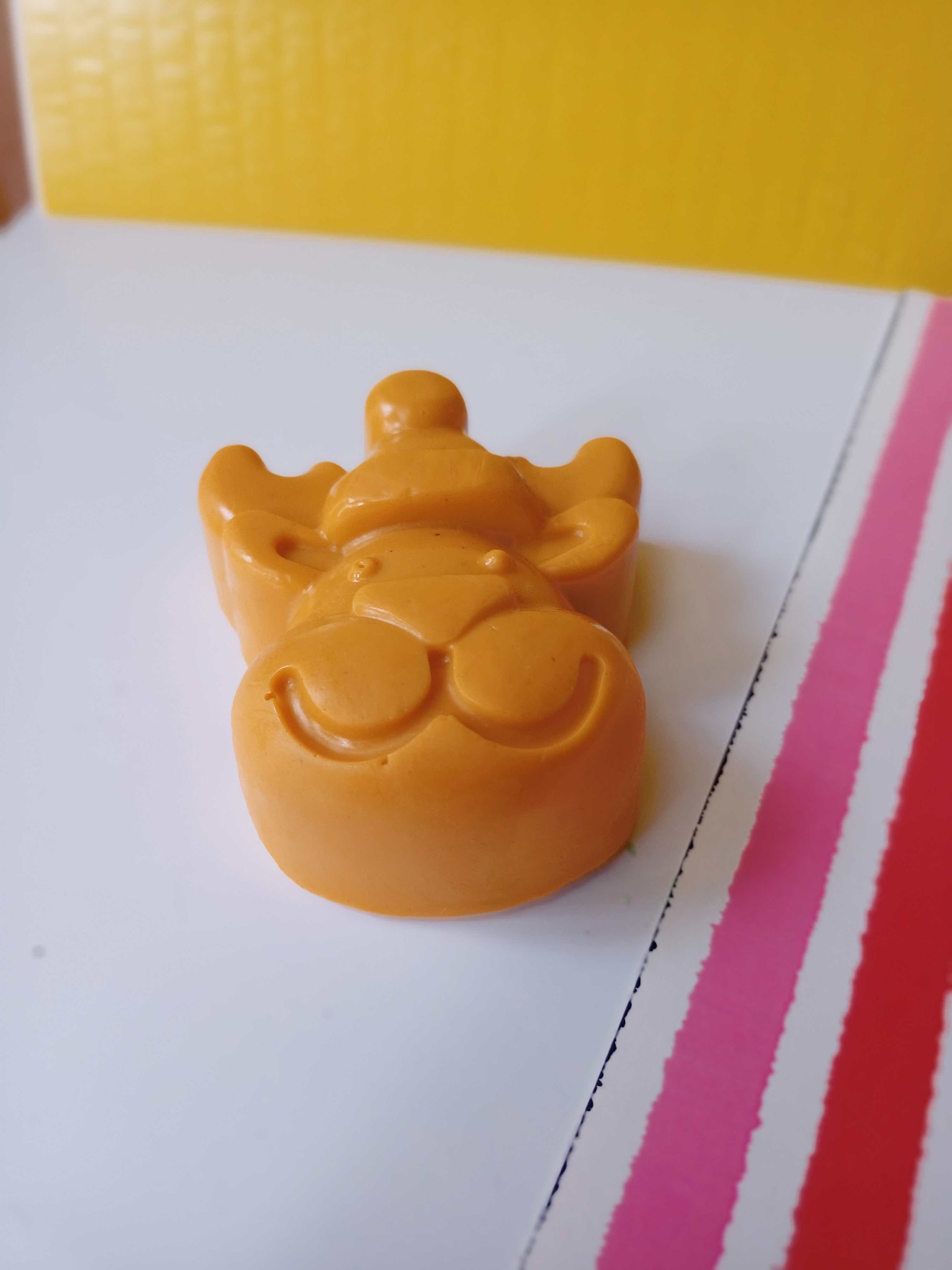 Reindeer shaped orange soap with multicolor base 