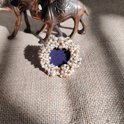 Blue finger ring with golden and white beads 