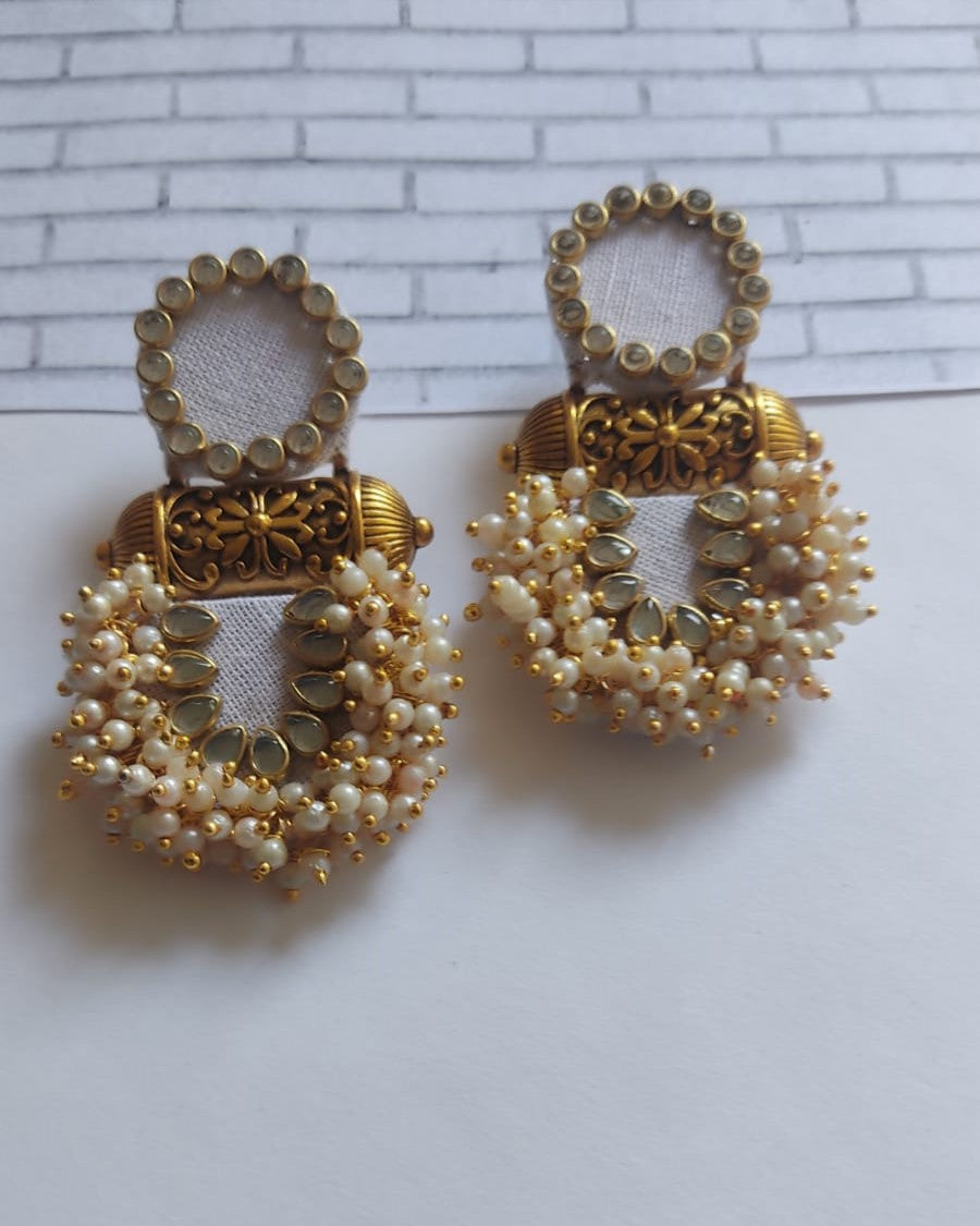 White earrings with golden beads, golden tabiz and kundan