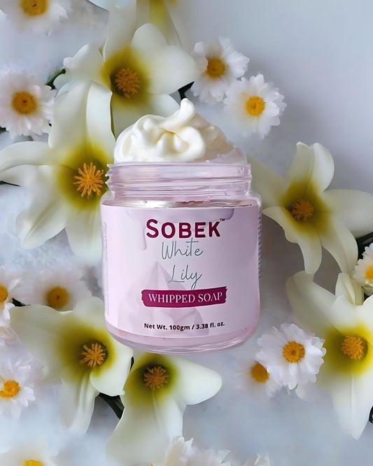 Sobek naturals white lily whipped soap on lily backdrop