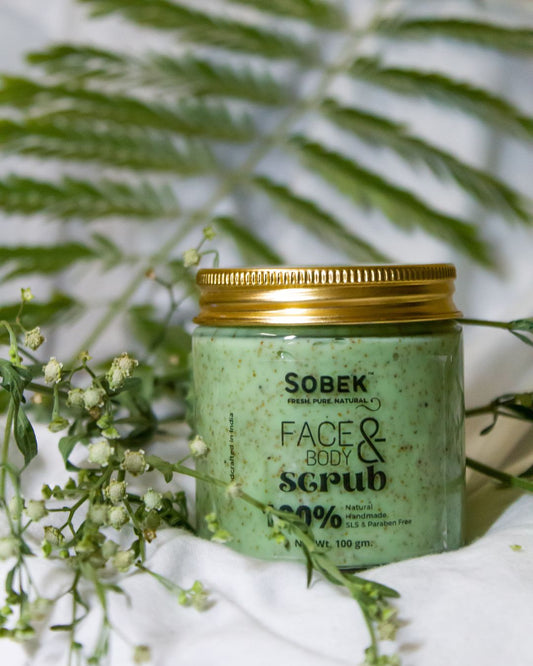 Sobek naturals neem and green tea scrub on white backdrop with neem leaves around