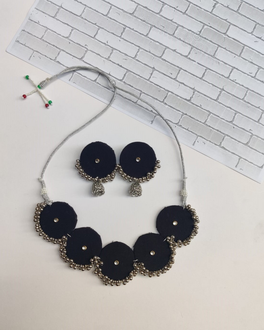 Black round shaped choker necklace and earrings with silver beads and jhumar at bottom